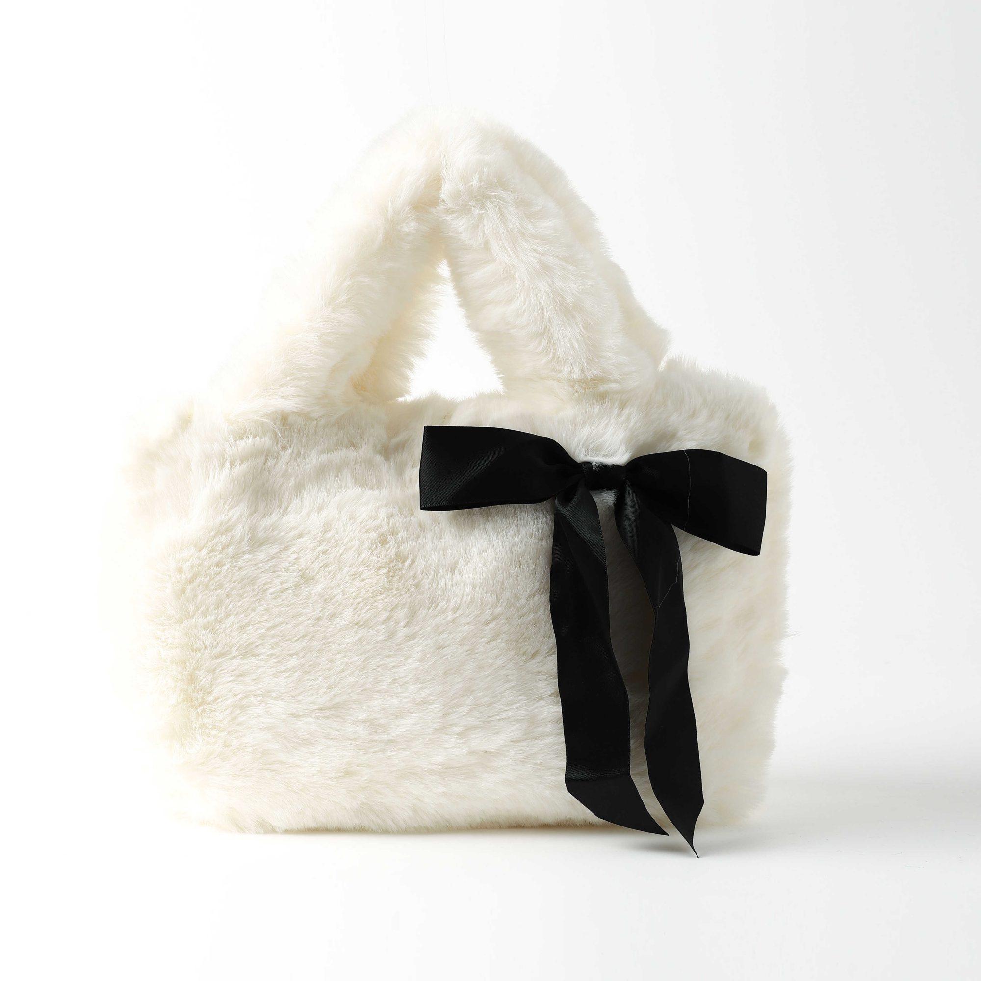 תיק פרווה שמנת ופפיון שחו